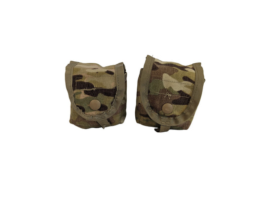 A studio shot of two U.S. Military Surplus hand grenade pouches in OCP/Multicam camouflage, shown side-by-side with closed snap-button flaps on a white background.