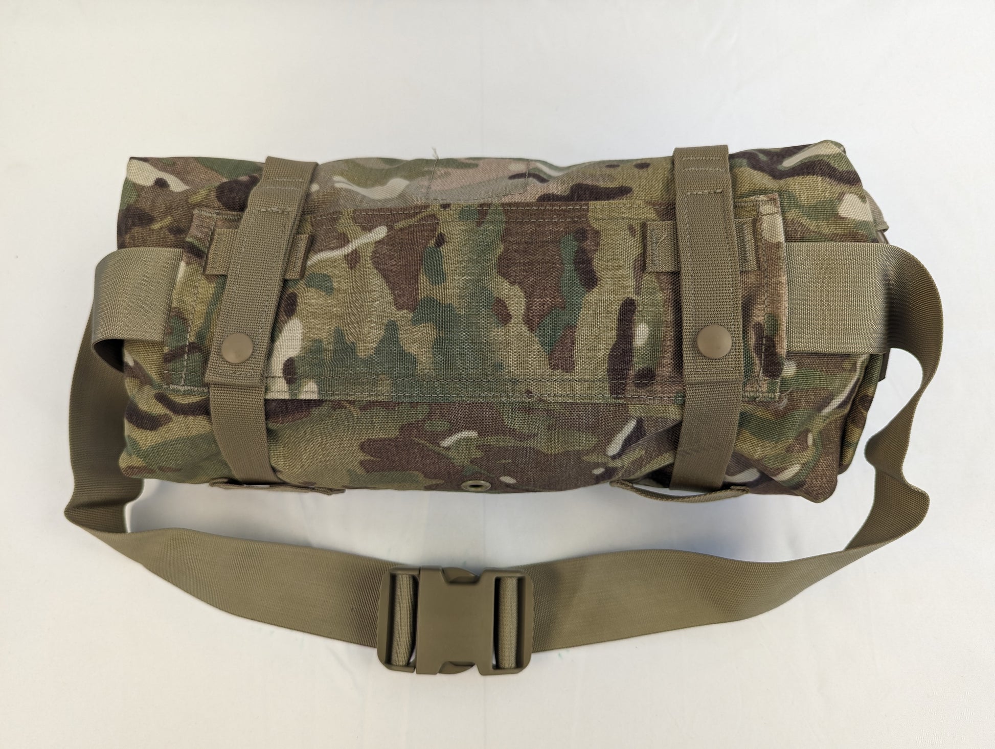 A U.S. Military Surplus OCP/Multicam Waist Pack secured with horizontal compression straps, featuring the khaki waist belt and quick-release buckle in the foreground.