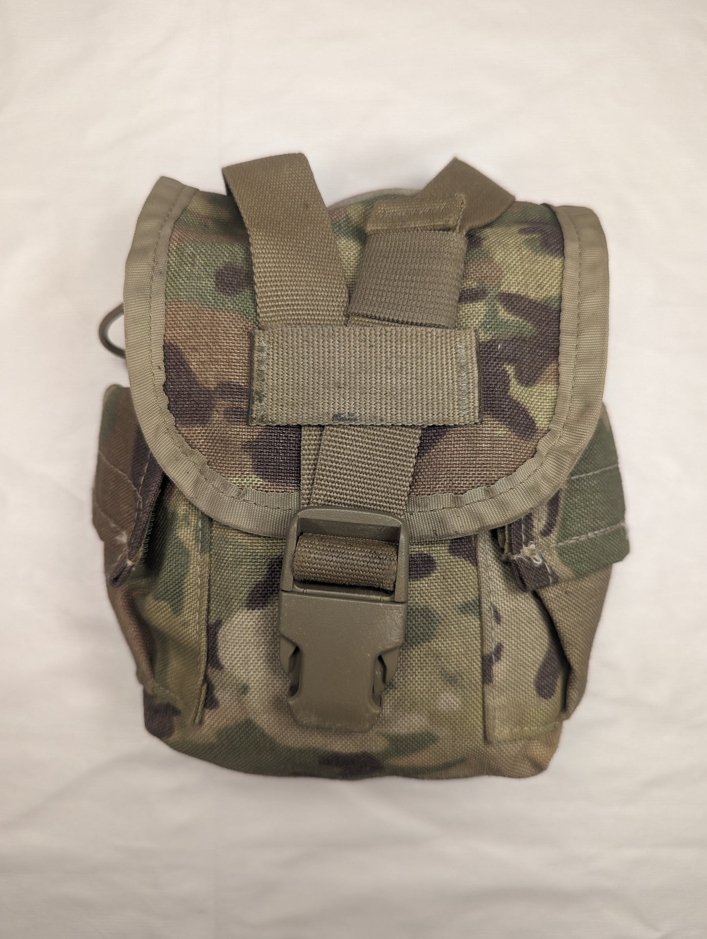 A single U.S. Military Surplus Canteen/General Purpose Pouch in OCP/Multicam camouflage, standing upright, featuring a flap closure secured by a tan quick-release buckle and horizontal webbing.