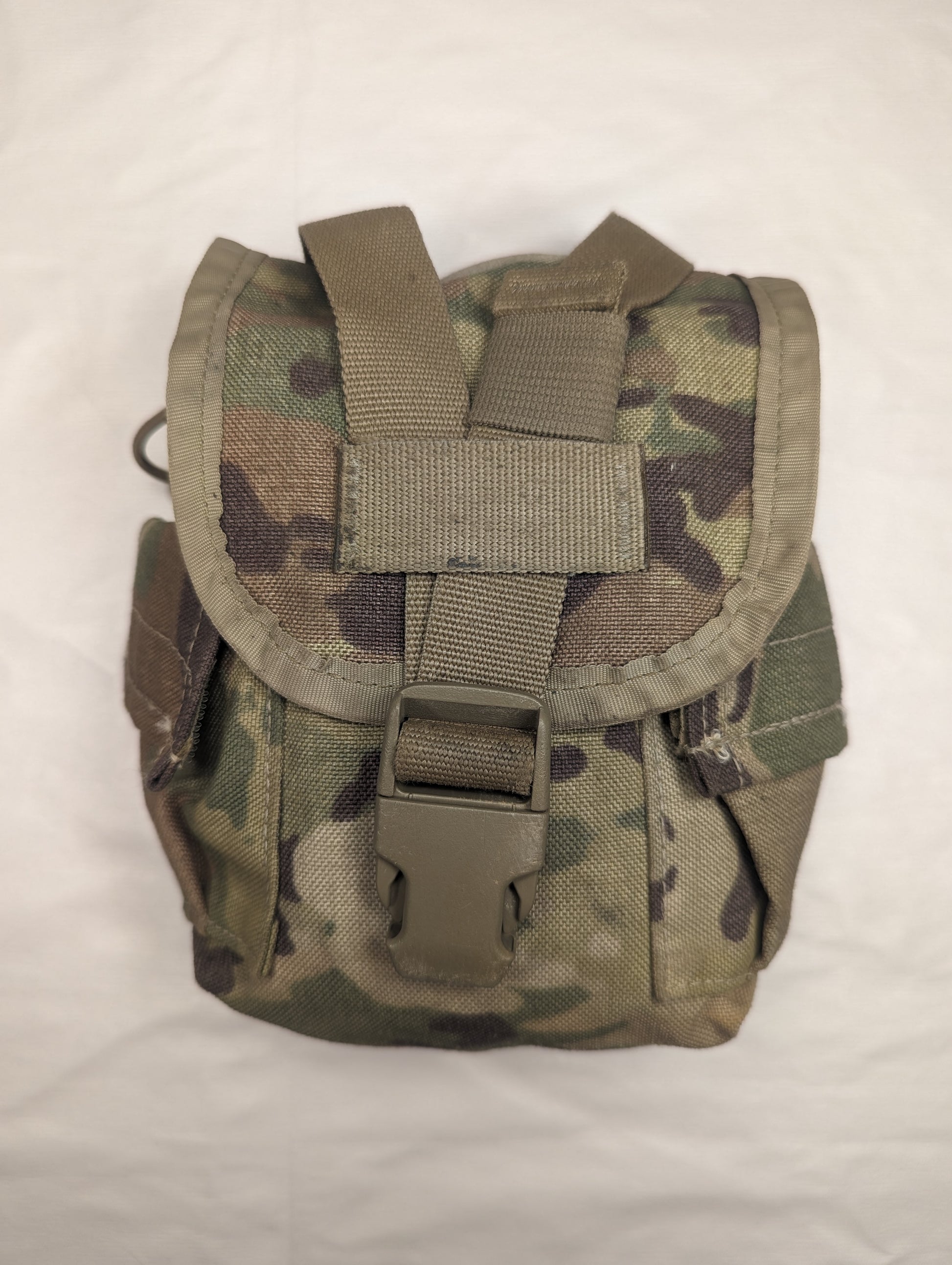 A single U.S. Military Surplus Canteen/General Purpose Pouch in OCP/Multicam camouflage, standing upright, featuring a flap closure secured by a tan quick-release buckle and horizontal webbing.